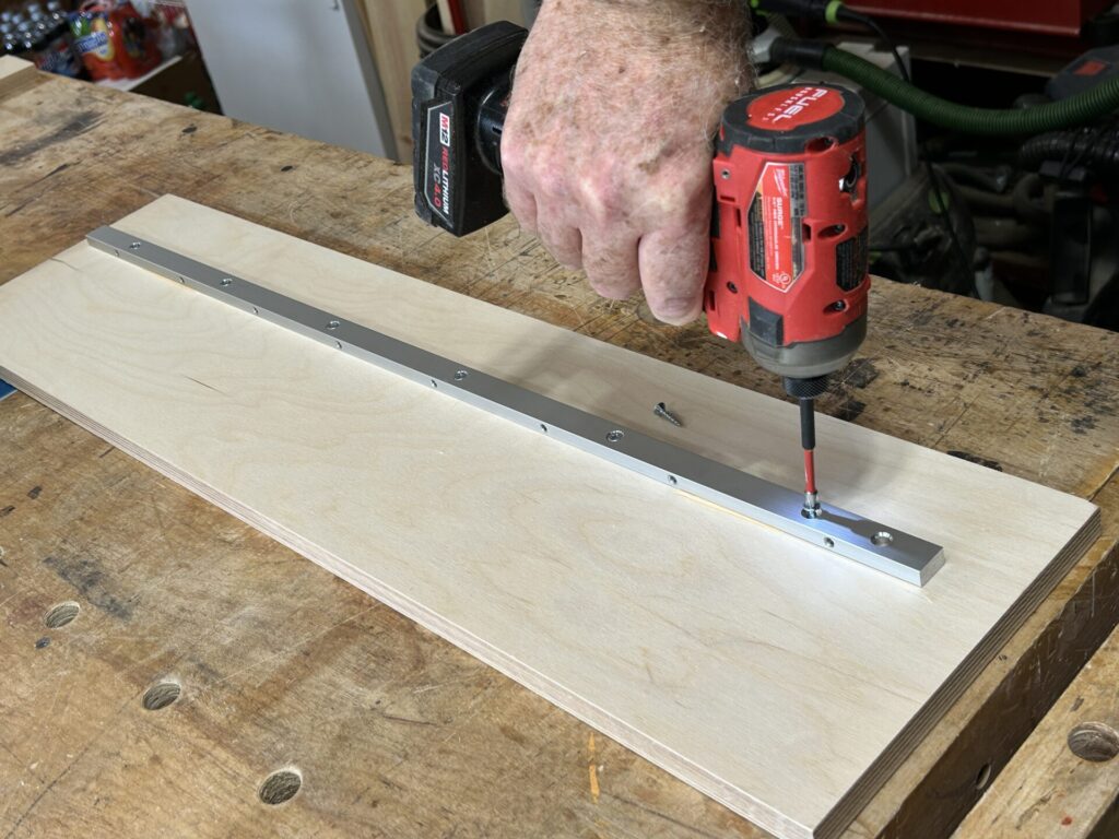 Screwing the miter bar to the base