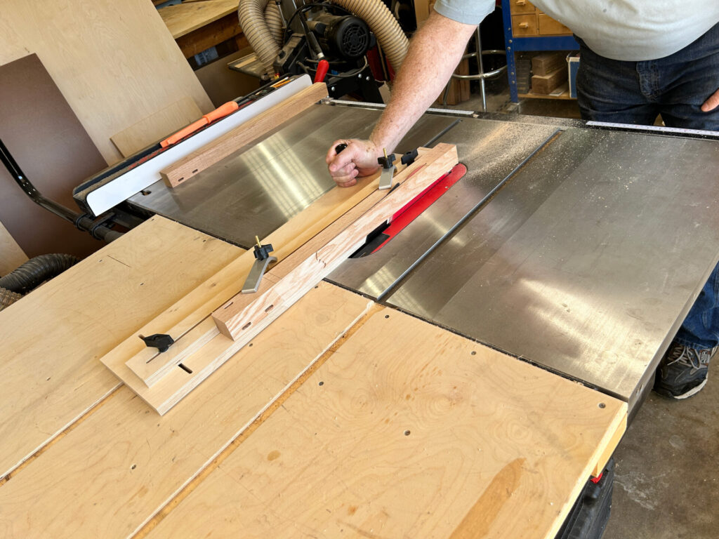 Cutting a taper on a table leg with a tapering sled